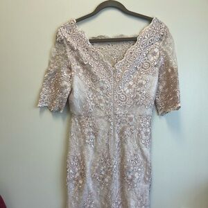 Beautiful below the knee designer mother of the bride dress. Blush in color.